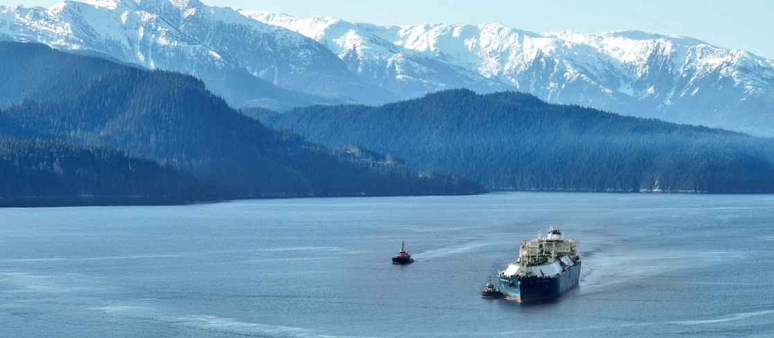 LNG tanker in a body of water at the base of mountains