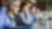 Professionals with laptops and notepads sitting in a row