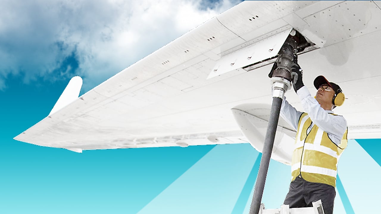 Man is fuelling a plane