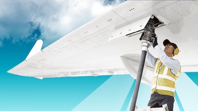 Man is fuelling a plane