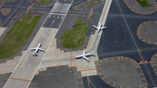  Aerial view above departing aircraft runway