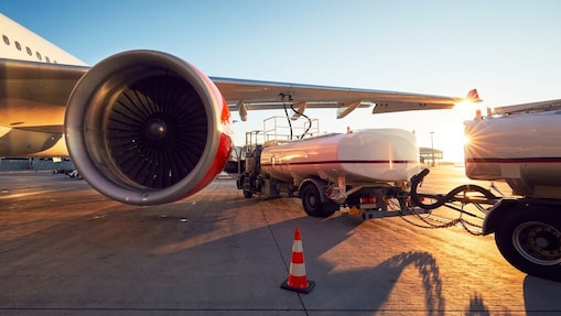 Airplane refuelling at sunset