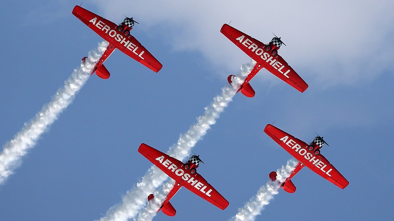 The Aeroshell Aerobatic Team gets into formation