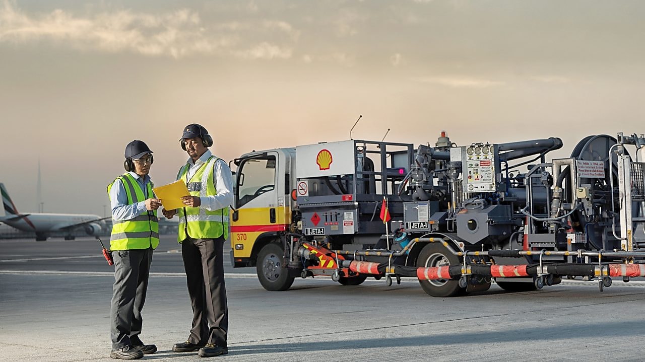 man and woman in front of machinery