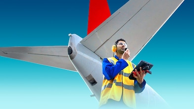 employee in front of aircraft