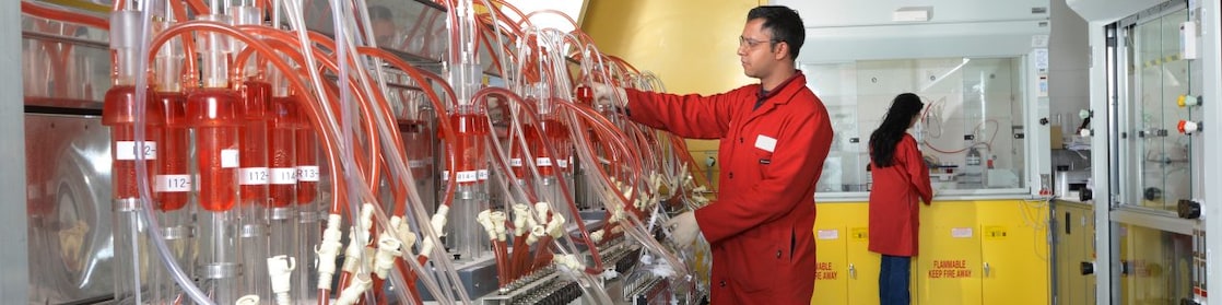 Scientist formulating and performing oxidation testing on aviation engine oil samples
