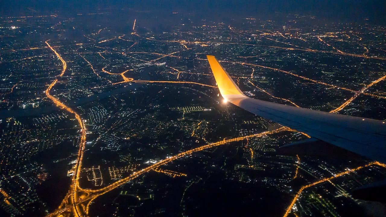 Bangkok city night view via aircraft window