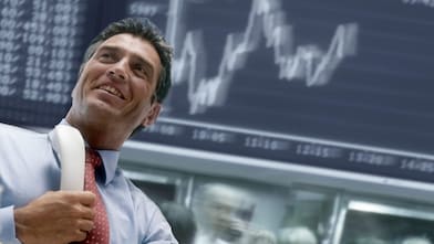 Man handling call on share maket