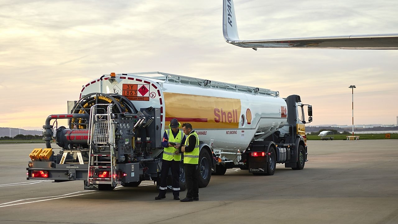 Man refuelling a Falcon 7X aircraft at Rotterdam Airport, The Netherlands