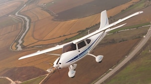 jet flying in the air and view of ground