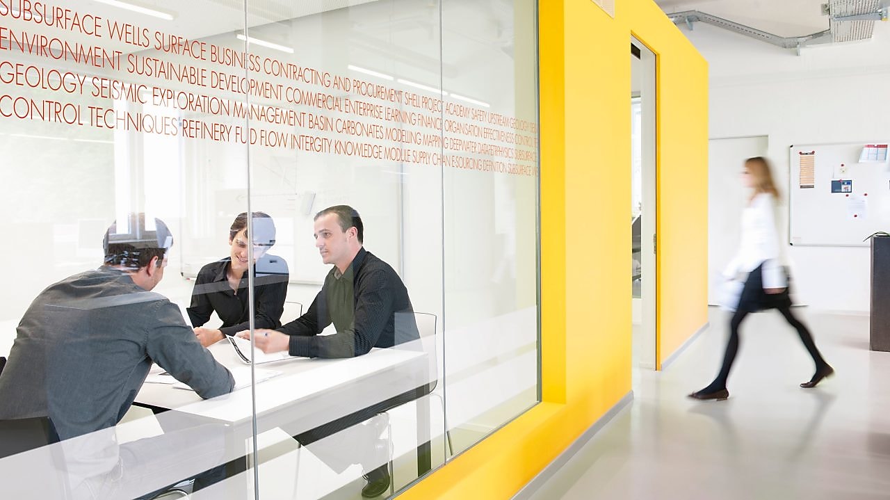 three people in meeting