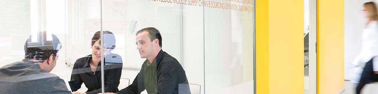 three people in meeting