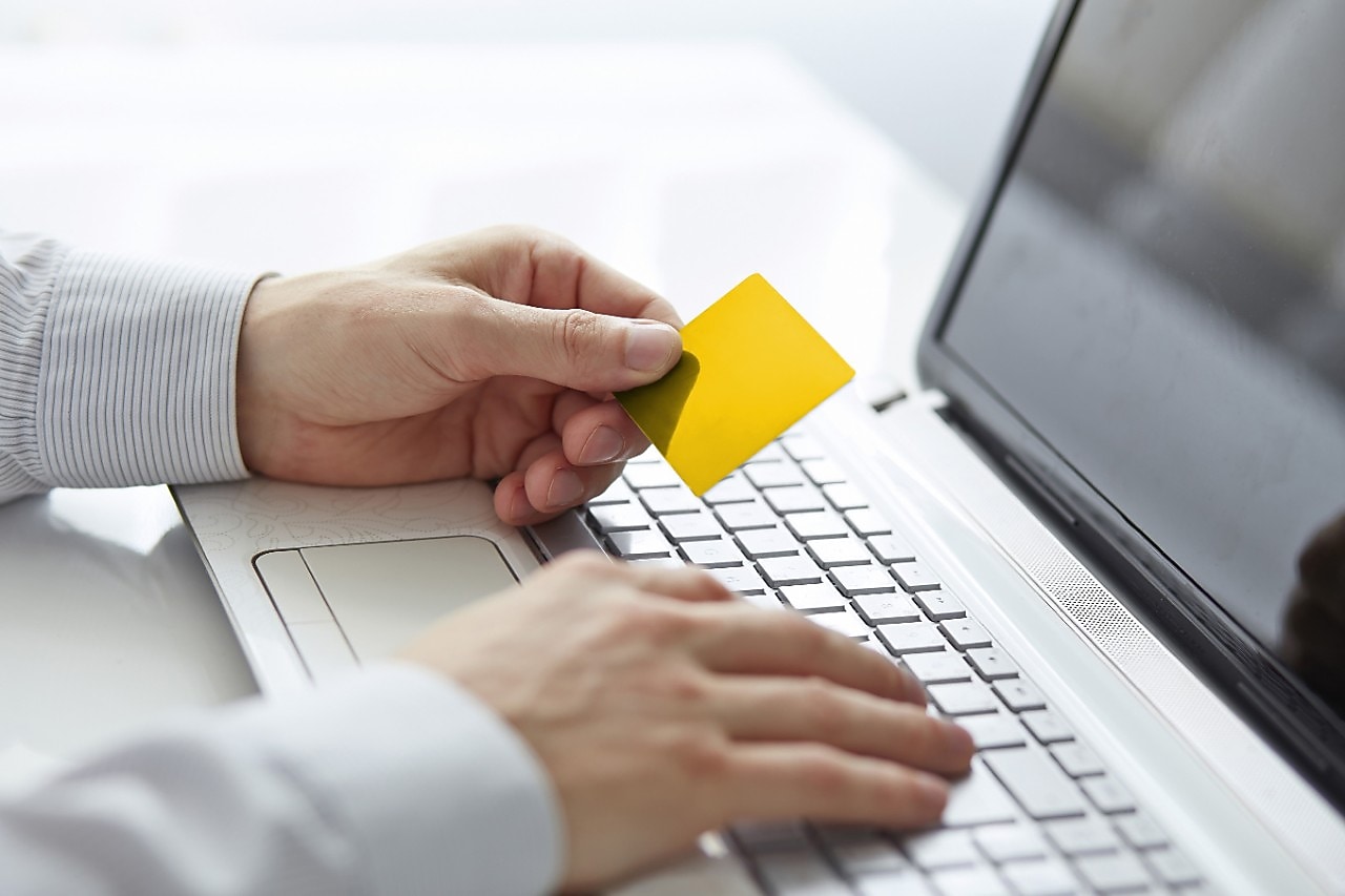 Man holding shell card in hand