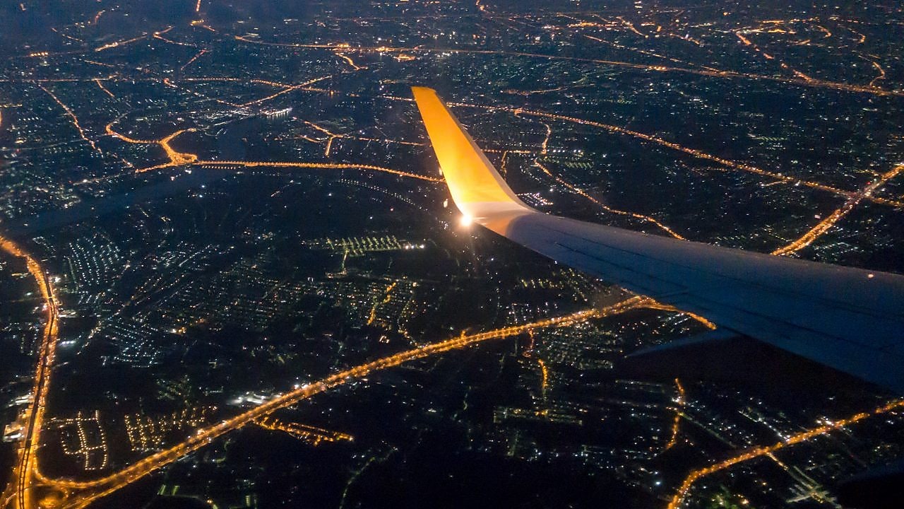 Bangkok city night view via aircraft window