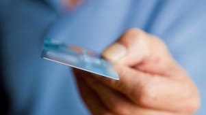 Person holding card in hand