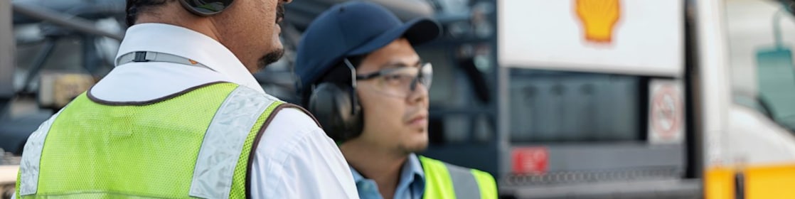 Two men working on site