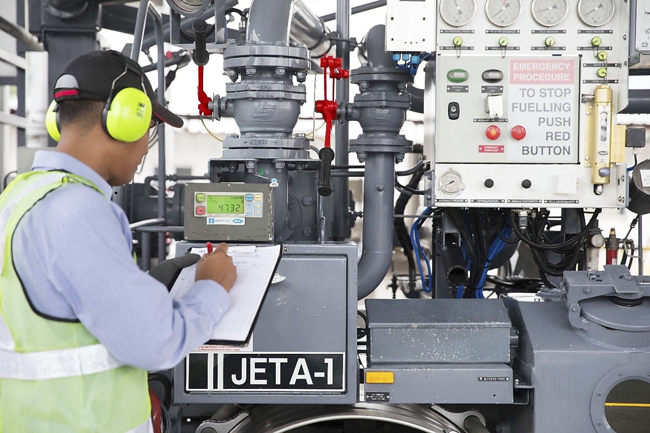 A staff checking the fueling status and operations