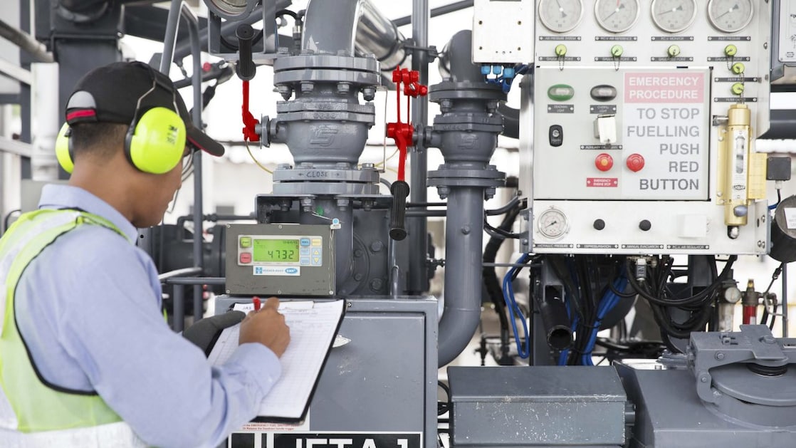 A staff checking the fueling status and operations