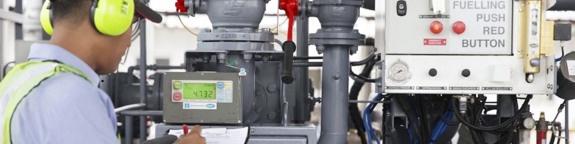 A staff checking the fueling status and operations