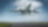 A commercial airplane is captured mid-takeoff, ascending into the sky from a runway on a clear day with scattered clouds.
