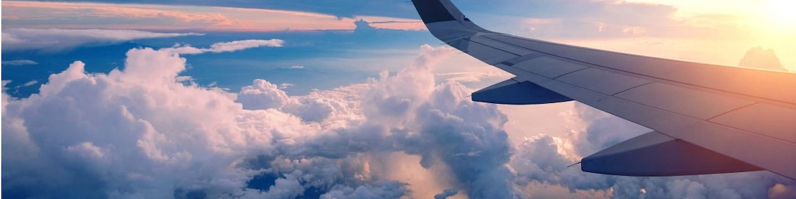 The wing of an aircraft above the clouds
