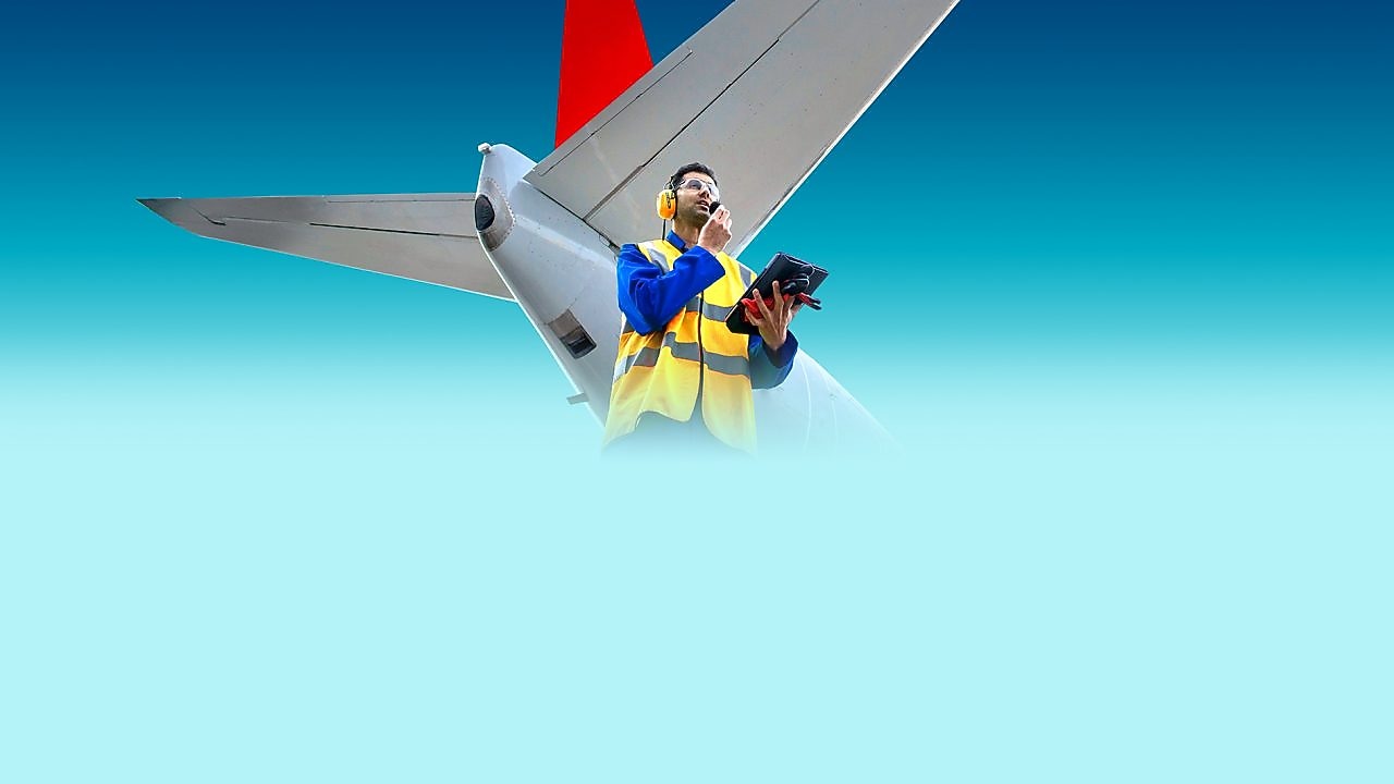 employee in front of aircraft