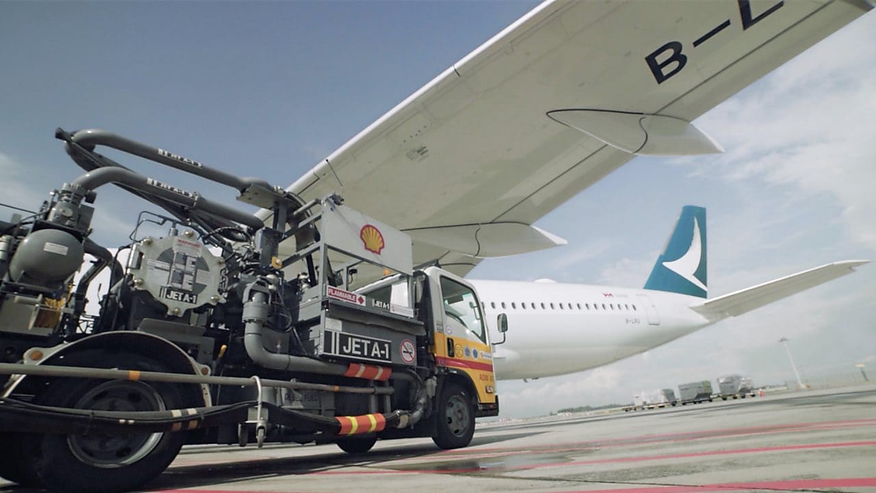 trcuk carrying load towards a plane