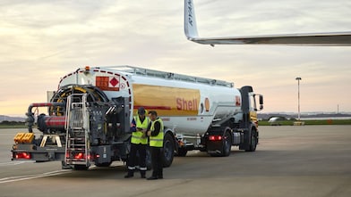 Man refuelling a Falcon 7X aircraft at Rotterdam Airport, The Netherlands