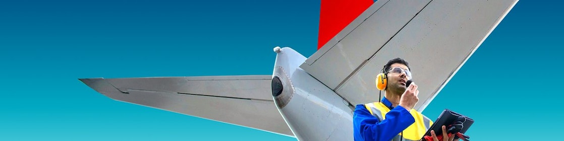 employee in front of aircraft