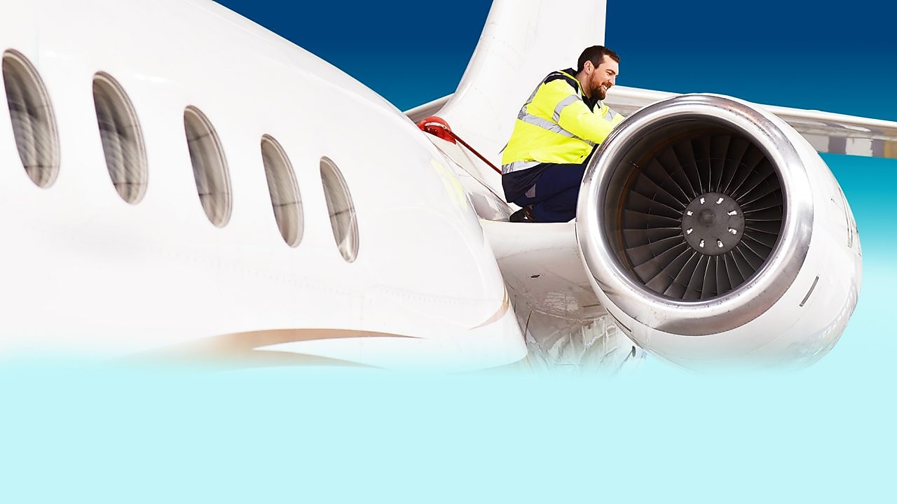 worker on the plane fixing