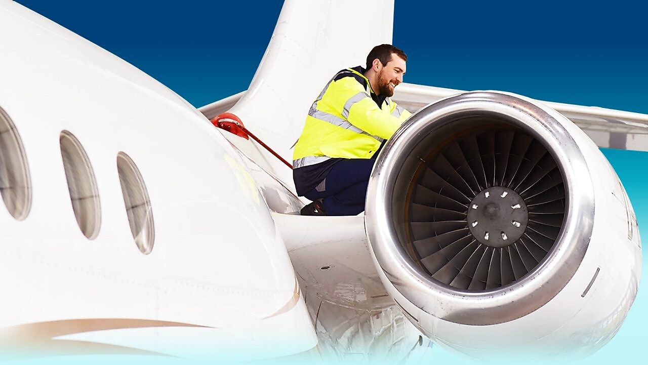 worker on the plane fixing