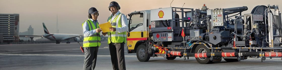 man and woman in front of machinery