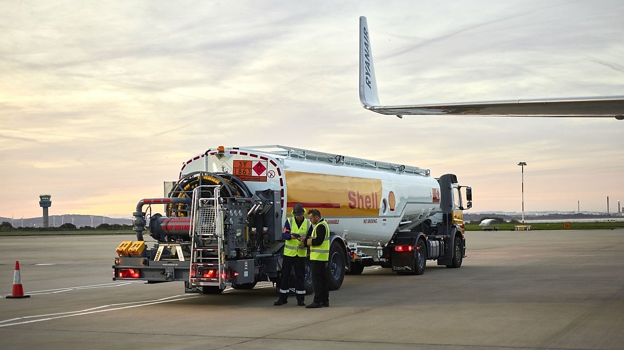 Man refuelling a Falcon 7X aircraft at Rotterdam Airport, The Netherlands