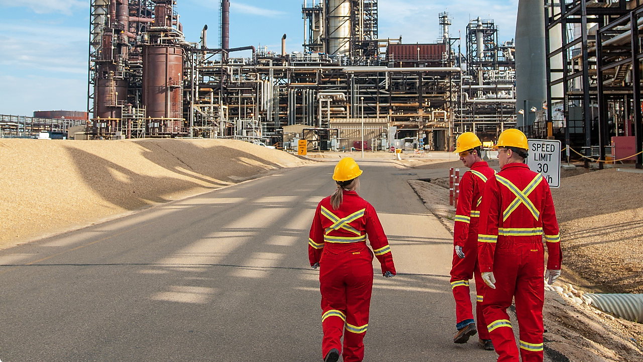 Shell Employee Walks a Ramp Outside of the Shell Eastern Petrochemical Complex in Singapore