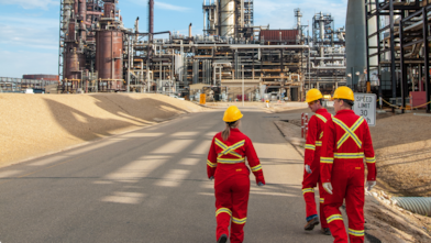 Shell Employee Walks a Ramp Outside of the Shell Eastern Petrochemical Complex in Singapore