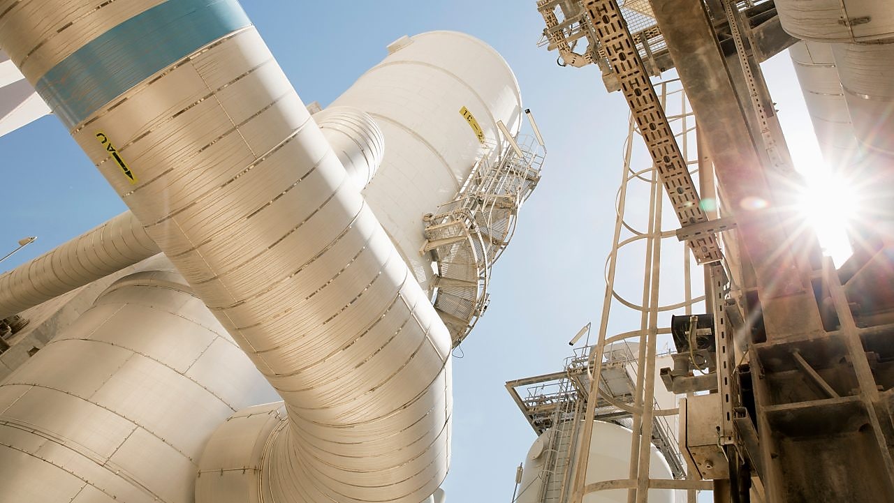 View from the ground outside of a refinery.