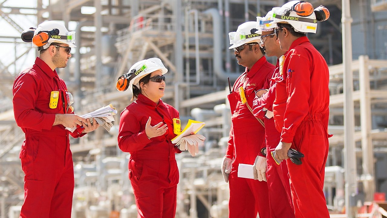 Onsite technicians have a tool box talk at the Base Oil Re-distillation Unit.