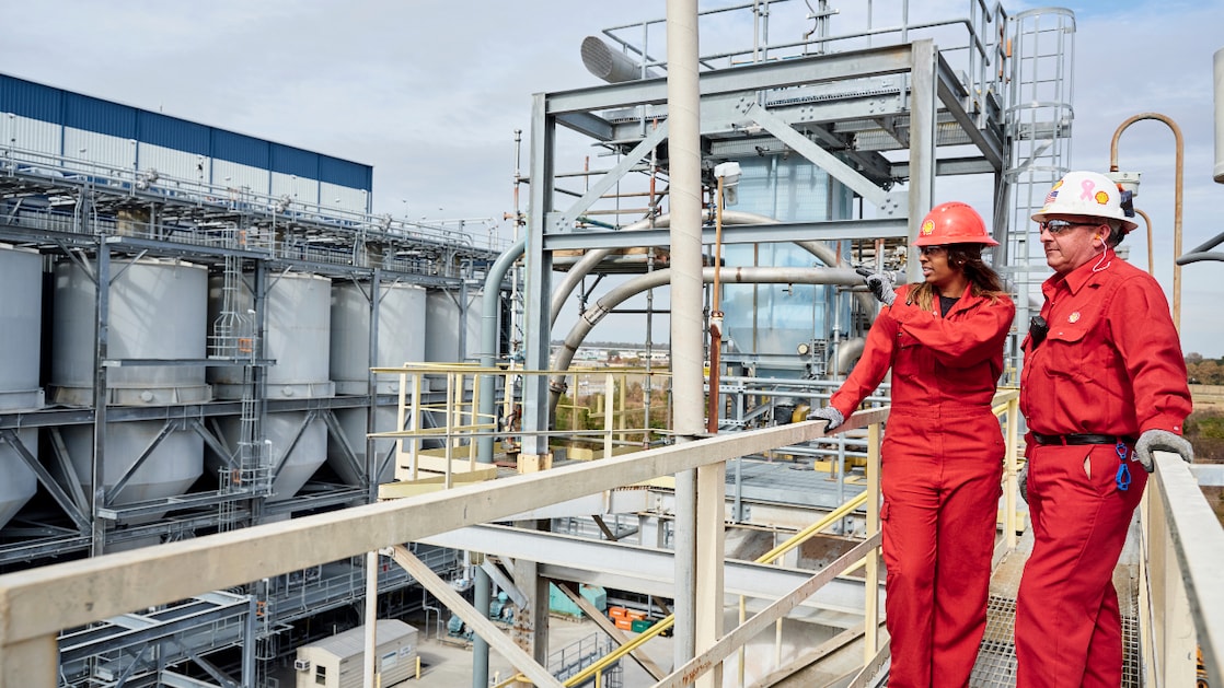 A worker radios for support at Sarnia Manufacturing Centre developing refining catalysts