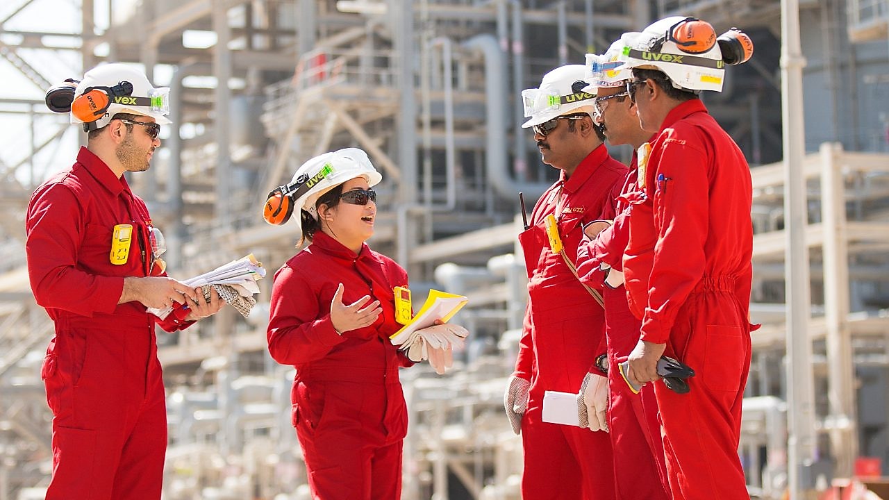 Onsite technicians have a tool box talk at the Base Oil Re-distillation Unit.