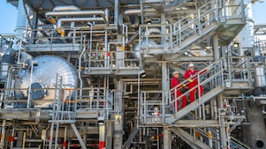 Onsite technicians have a tool box talk at the Base Oil Re-distillation Unit.