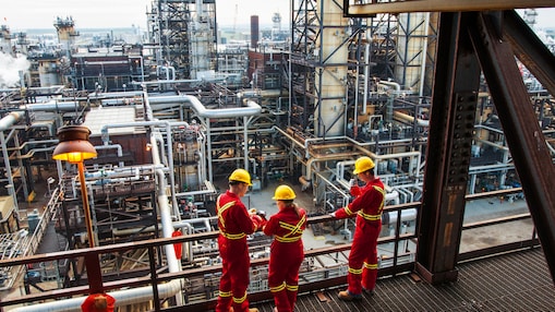 three workers discussing at Scotford plant