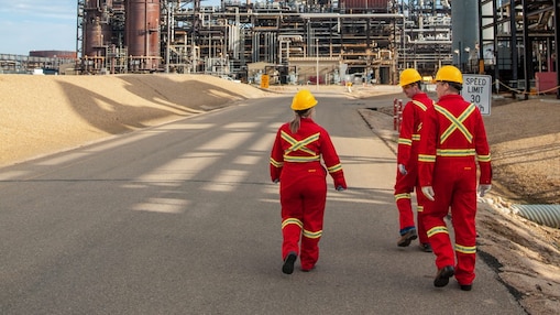 Three employee walking