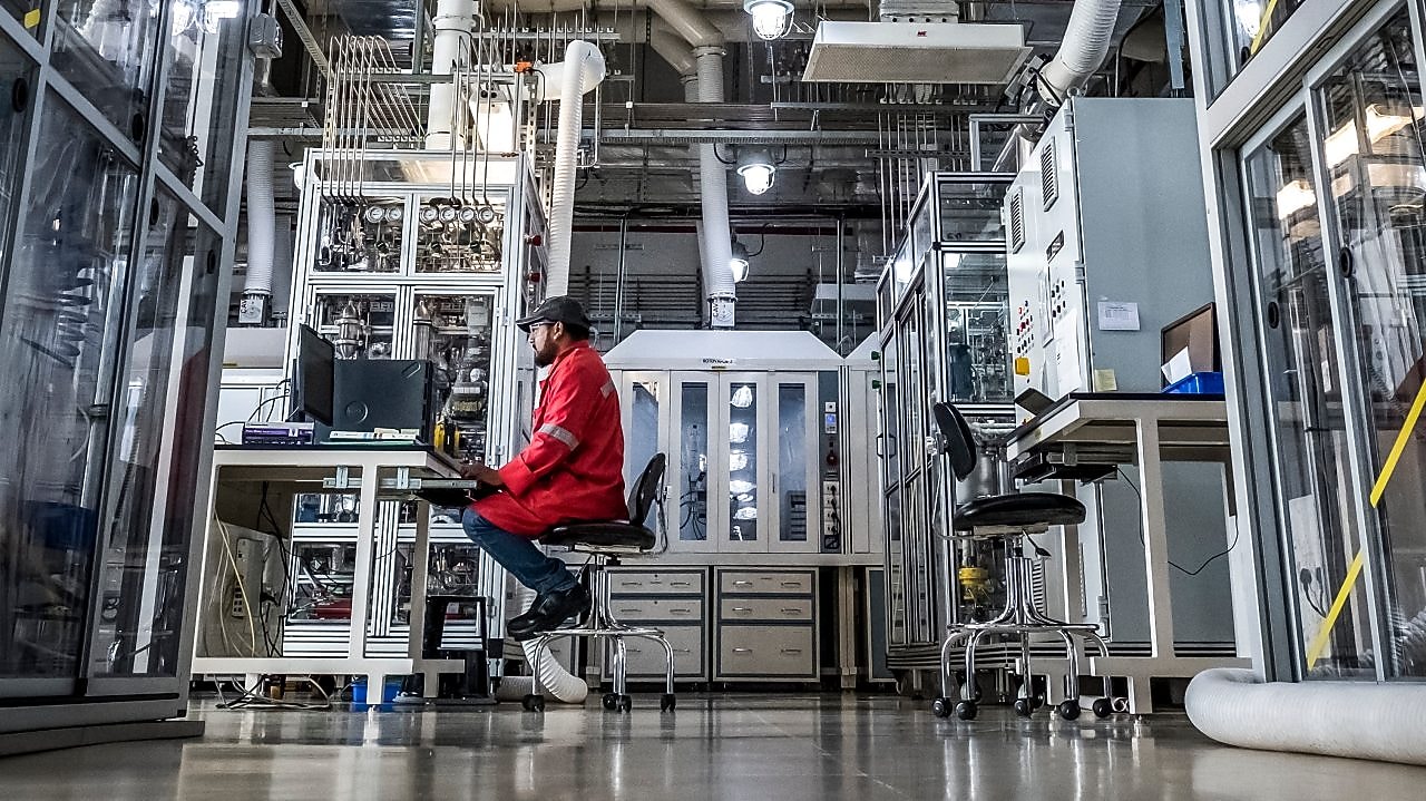 Shell Technology Centre, Bangalore. A Shell scientist working at computer Bangalore, India, 2018