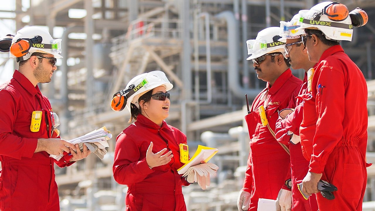 Onsite technicians have a tool box talk at the base oil re distillation unit