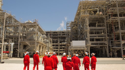 Shell employees walking at the Pearl GTL facility