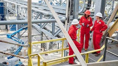 Employees standing at site