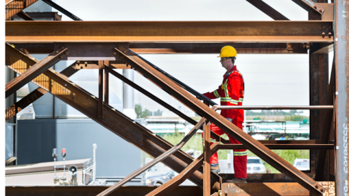 Worker climbing stairs at Quest Carbon Capture and Storage