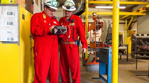 two shell employees in hard hats