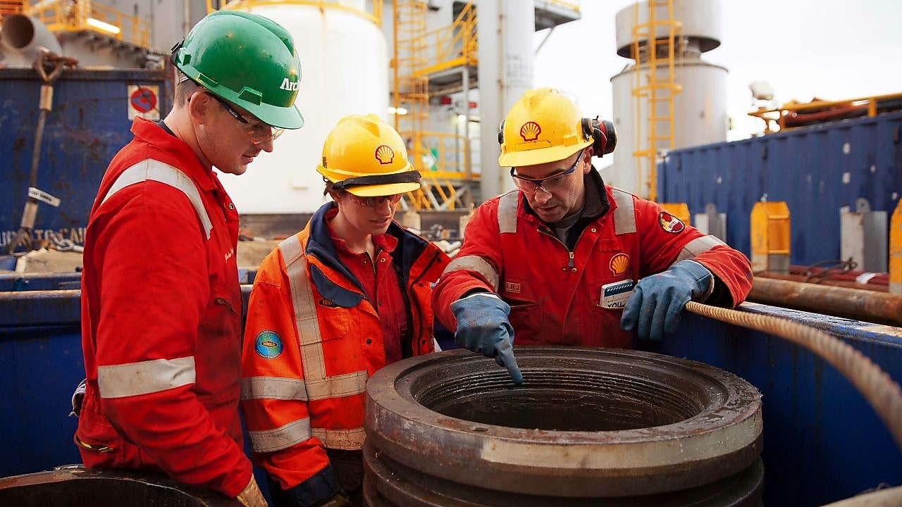 Crude Oil Processing supervisor examining equipment