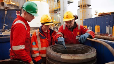Crude Oil Processing supervisor examining equipment